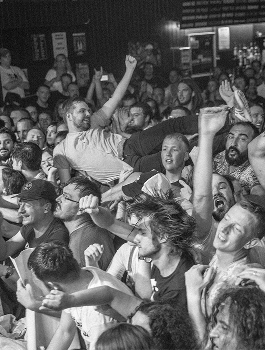 The Photographer crowdsurfing at Diarrhea Planet show